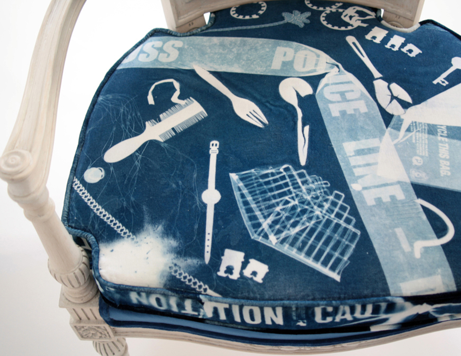 Found objects were used to print photograms onto velvet using the cyanotype method. This traditional photographic process produces a cyan blue print which deepens in intensity under UV light.