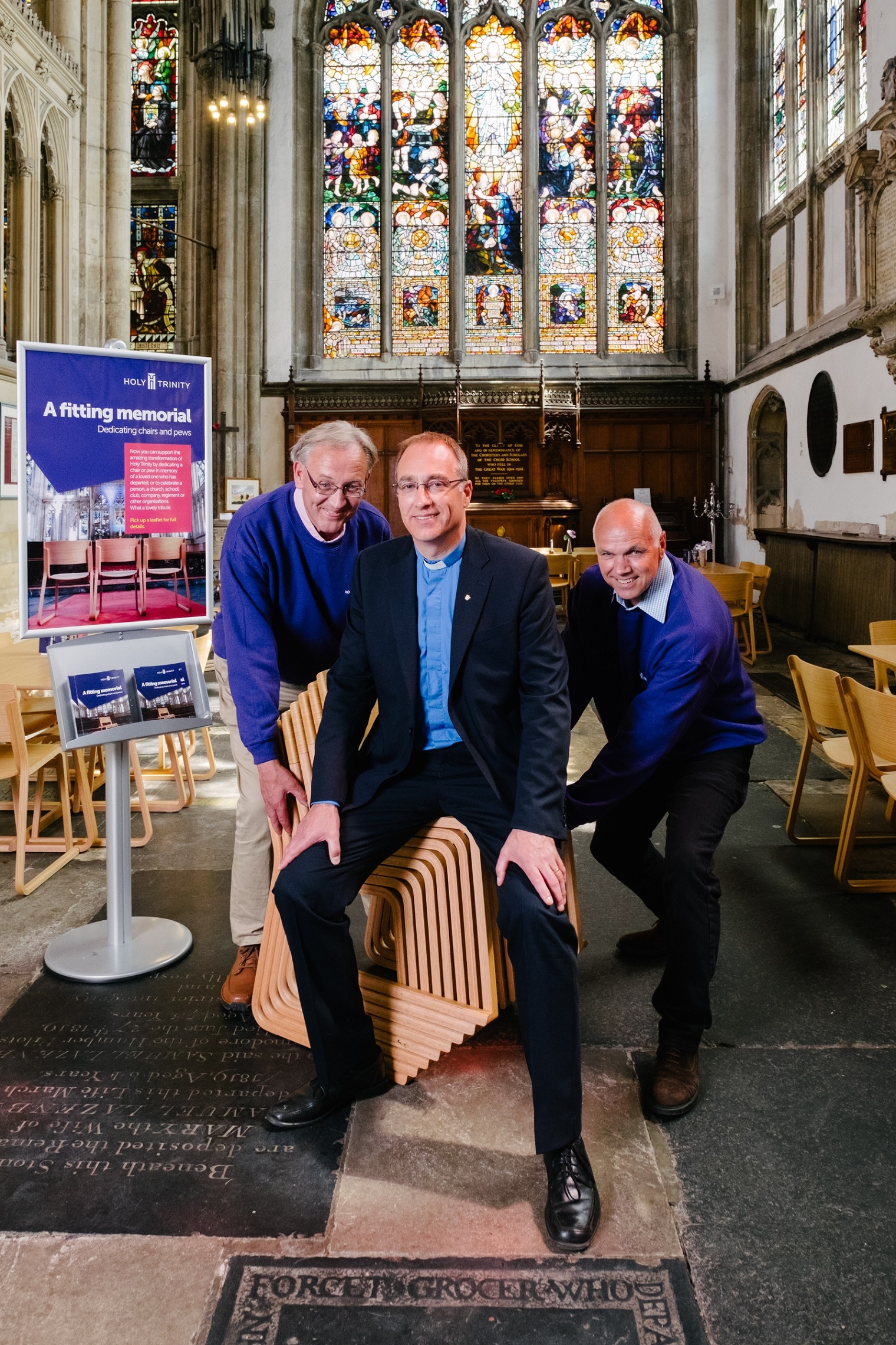Volunteers Ray Taylor, left, and John Lawson help Vicar Neal Barnes to launch the appeal for supporters of Holy Trinity to dedicate new chairs within the church.