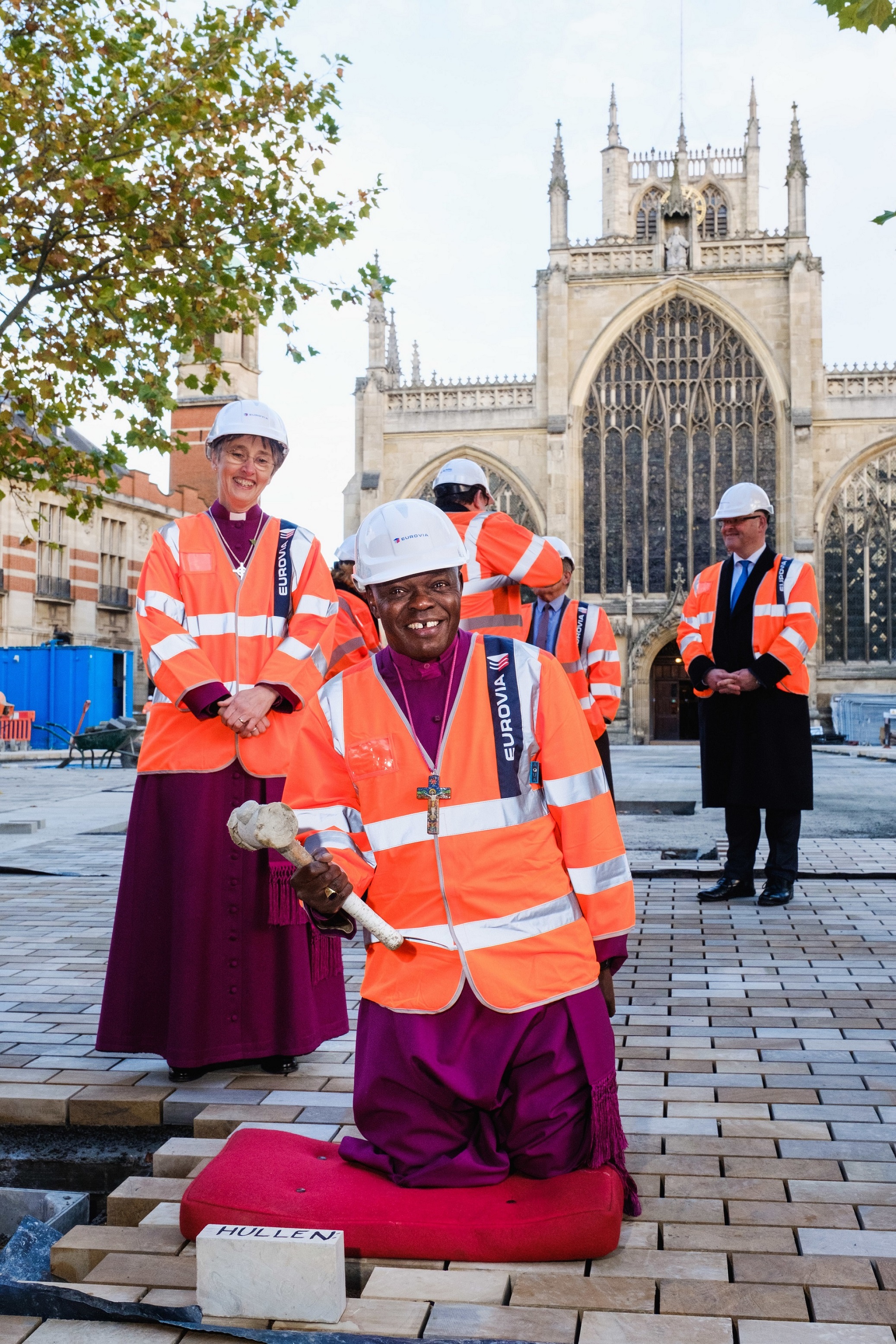 The Archbishop of York wields a mallet as he prepares to hammer in a paving stone as part of the redevelopment of Trinity Square, in the shadow of Hull’s historic Holy Trinity Church.