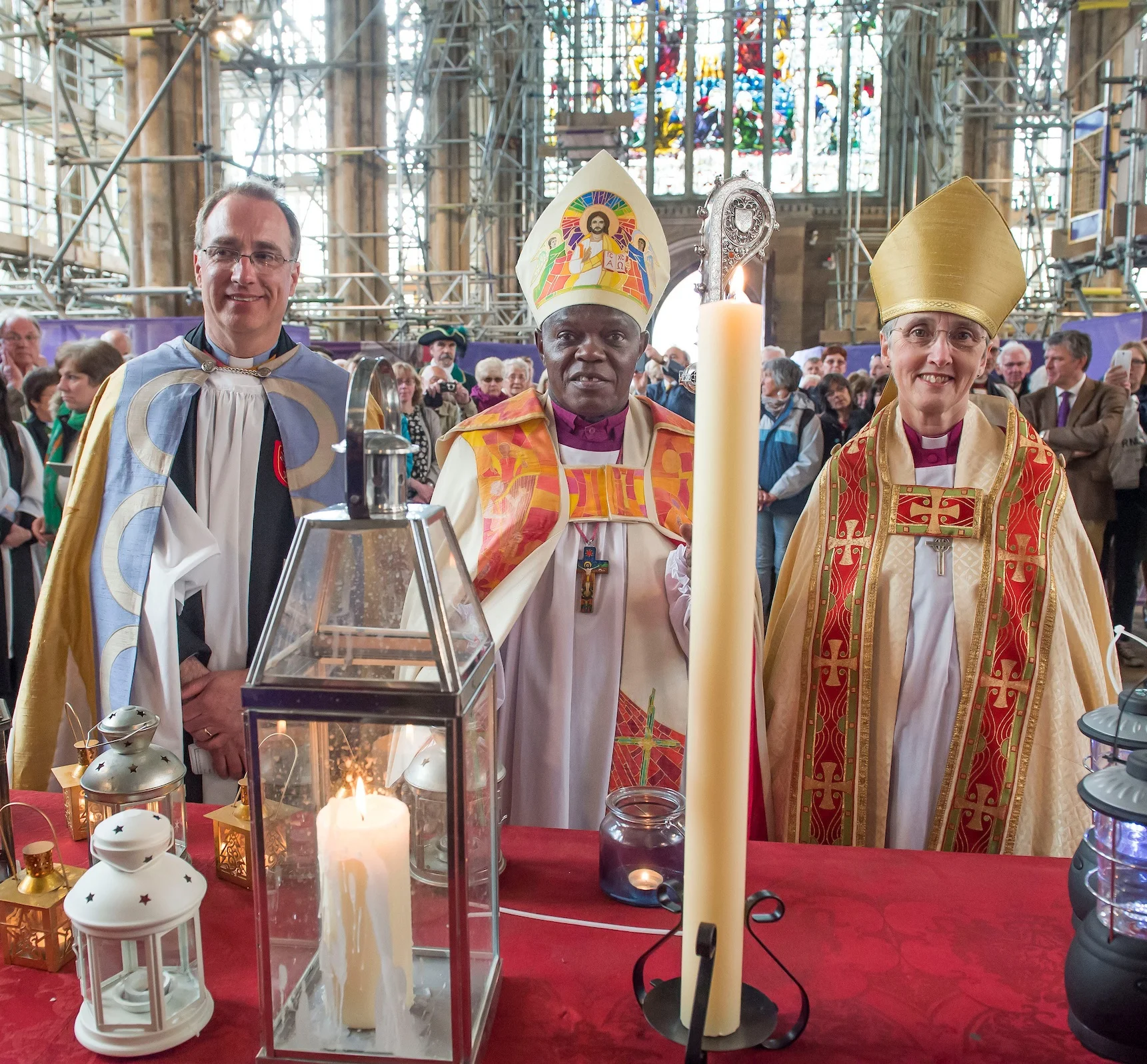 The Archbishop of York, Dr John Sentamu; the Bishop of Hull, the Rt Rev Alison White; and the Vicar of Holy Trinity, the Rev Canon Dr Neal Barnes; with the Minster candle and the lantern carried on the Humber voyage from which it was lit.