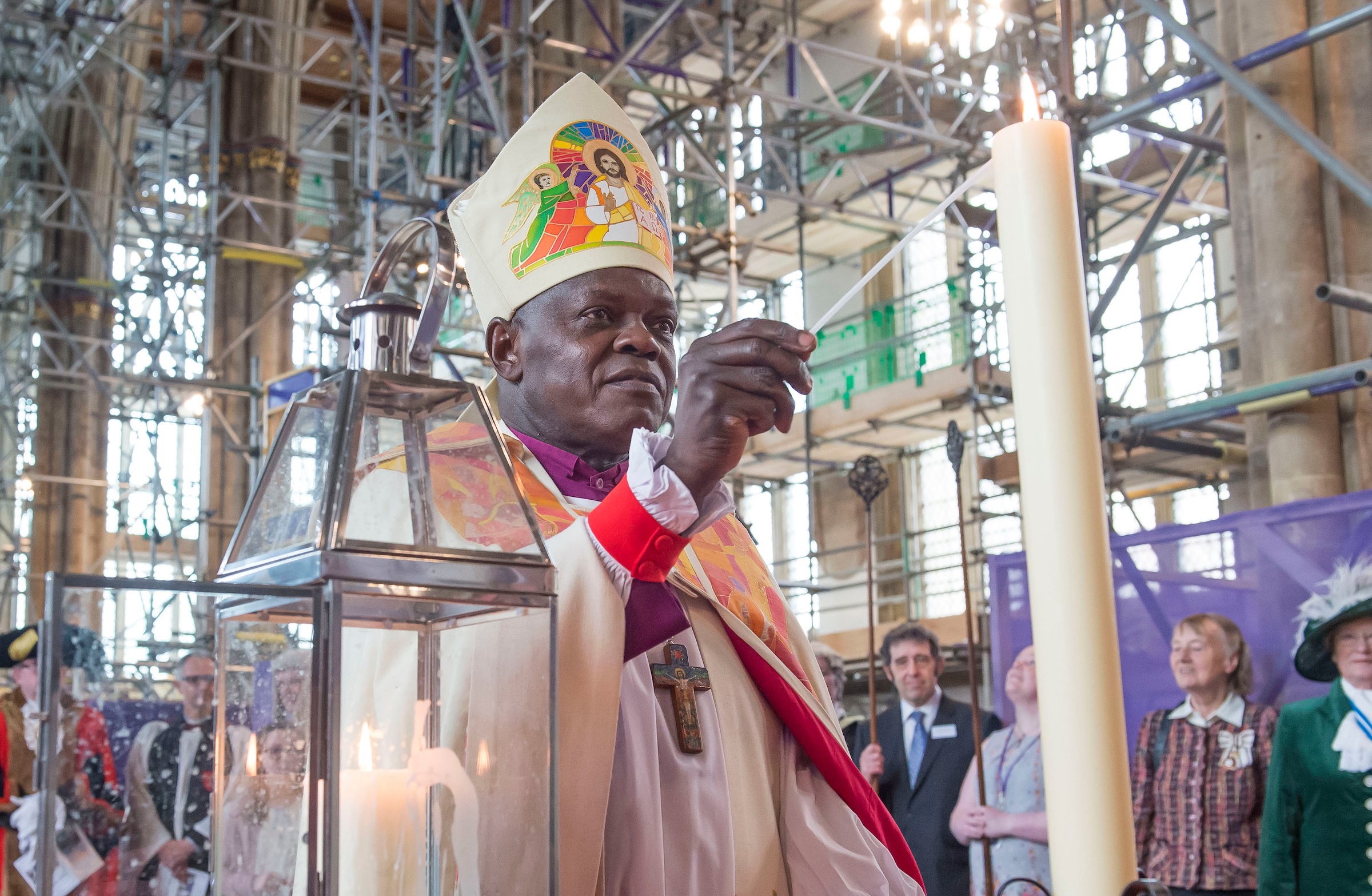 The Archbishop of York lights the Minster candle with a flame from Holy Trinity’s “mother” church, All Saints at Hessle.