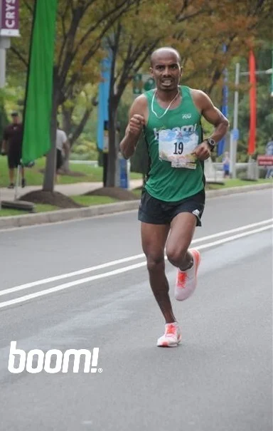 Desta on the way to 2nd OA finish at 2016 Marine Corps Marathon
