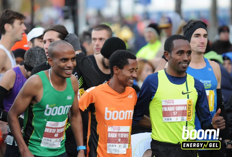 Desta and fellow Ethiopian Dadi Beyene sharing a laugh on the start line at 2016 Philadelphia Marathon
