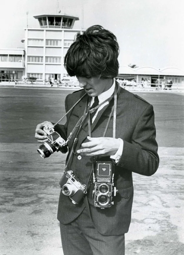 George Harrison with a Nikon F, Kodak Retina IIS and Rolleiflex cameras