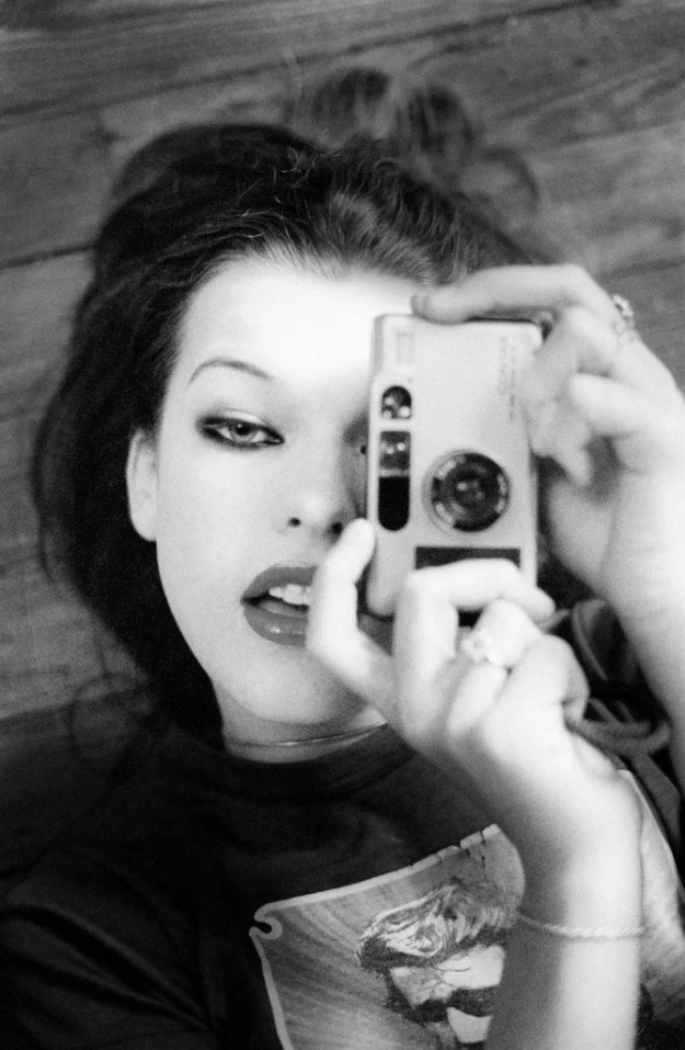 Milla Jovovich with Contax T2 camera