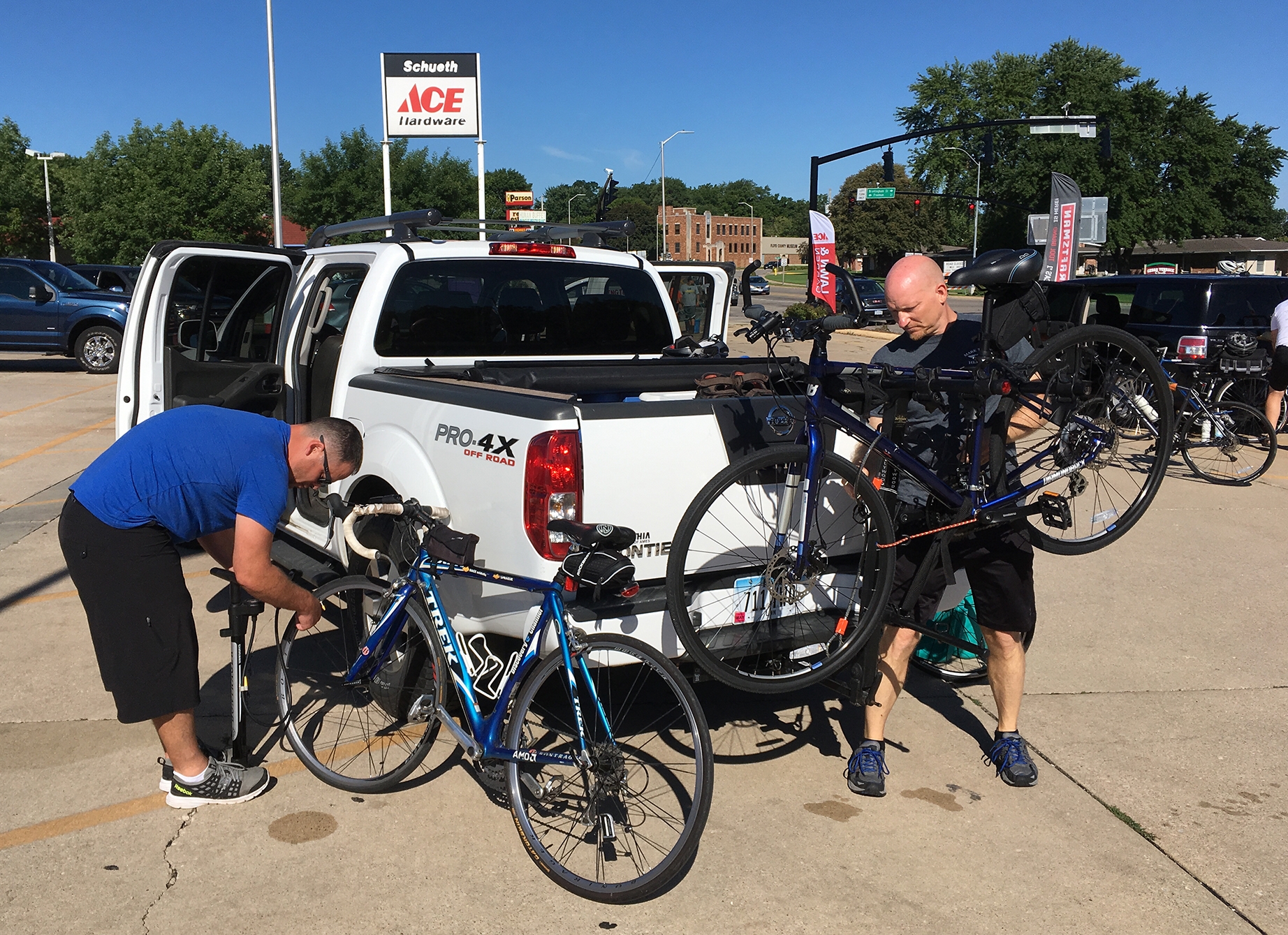  Jason Spangler and Pat Marlow prepare their bikes before departing Charles City. 