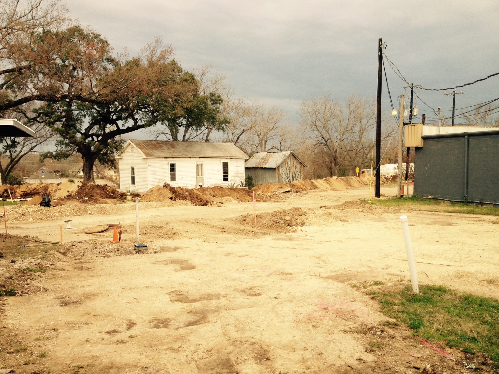 Trenching for the electrical lines by the Doherty House, one of the buildings on the Mill property. 