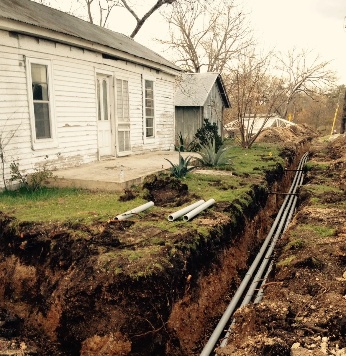 Electrical lines heading to a pad-mounted transformer