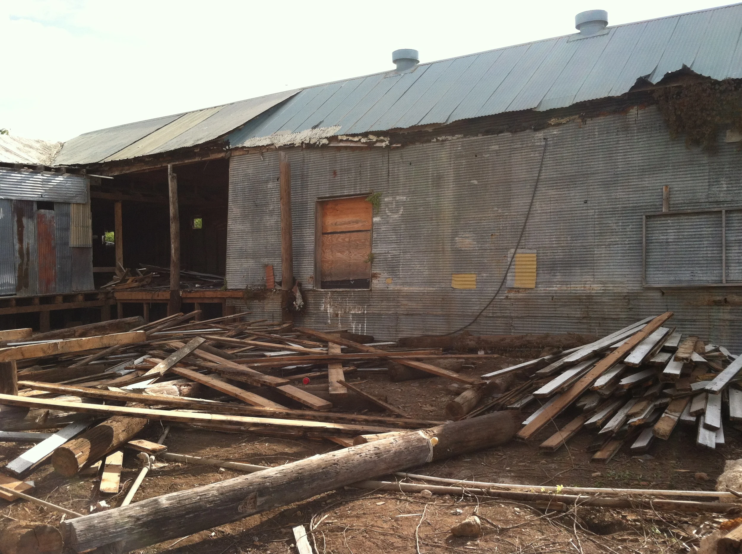 Old wood flooring was salvaged from 306 S Main and taken to Vintage Mills to be milled.