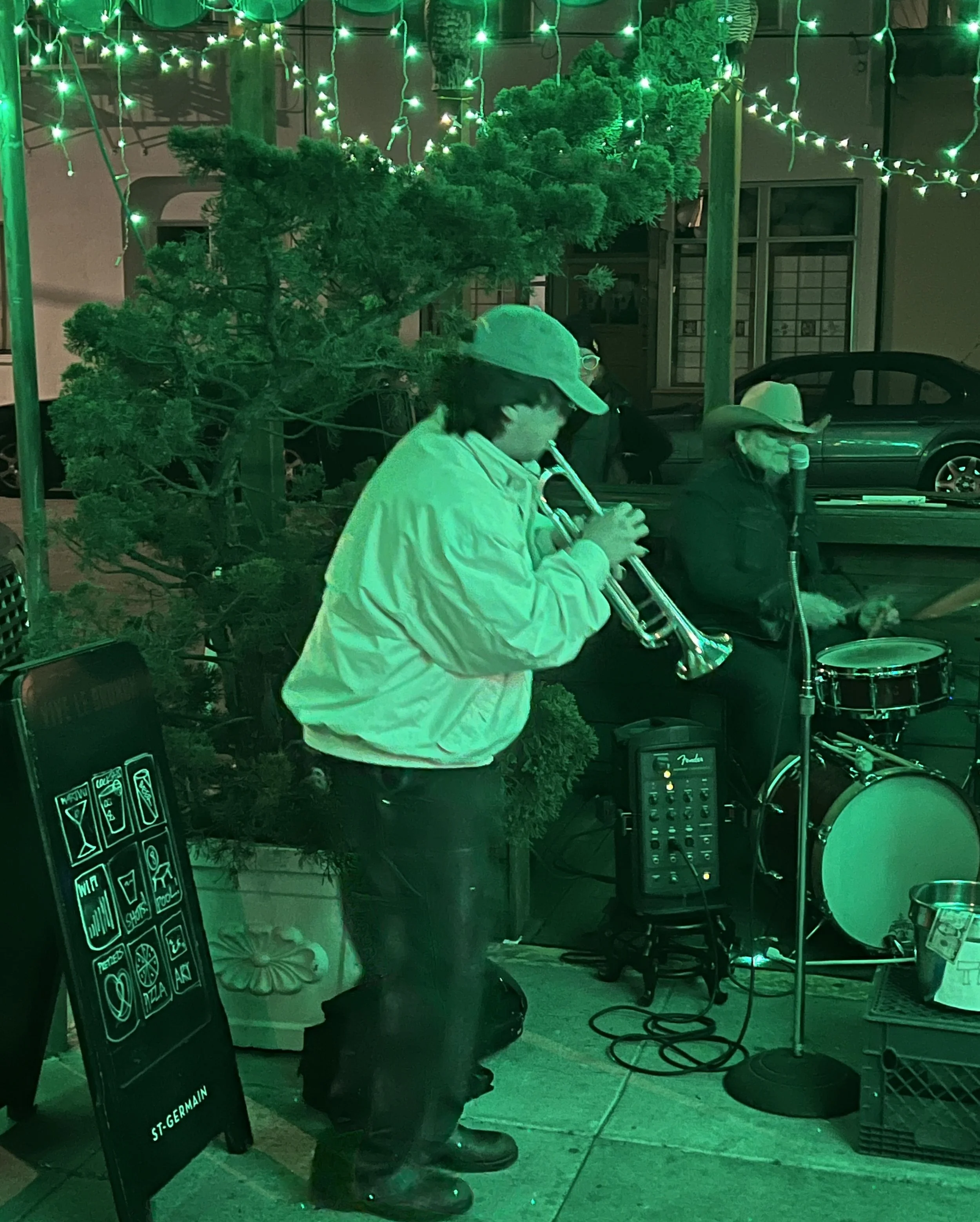  Guest horn player steps in at Sweetie’s Art Bar’s monthly Art + Jazz First Friday. 