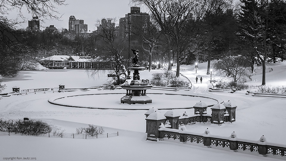 Two people trudge through the snow at Bethesda Terrace in Central Park. ISO 400, 1 sec. f5.6, 24mm lens.