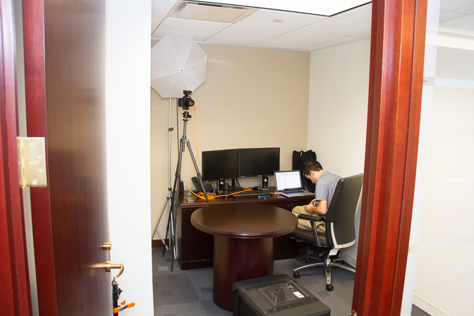 There was so little room in this space that it limited my options for setting up the shot. I pushed the desk to one side, which left 18 inches for me to squeeze into and shoot; you can see my umbrella and tripod are back as far as they can go.