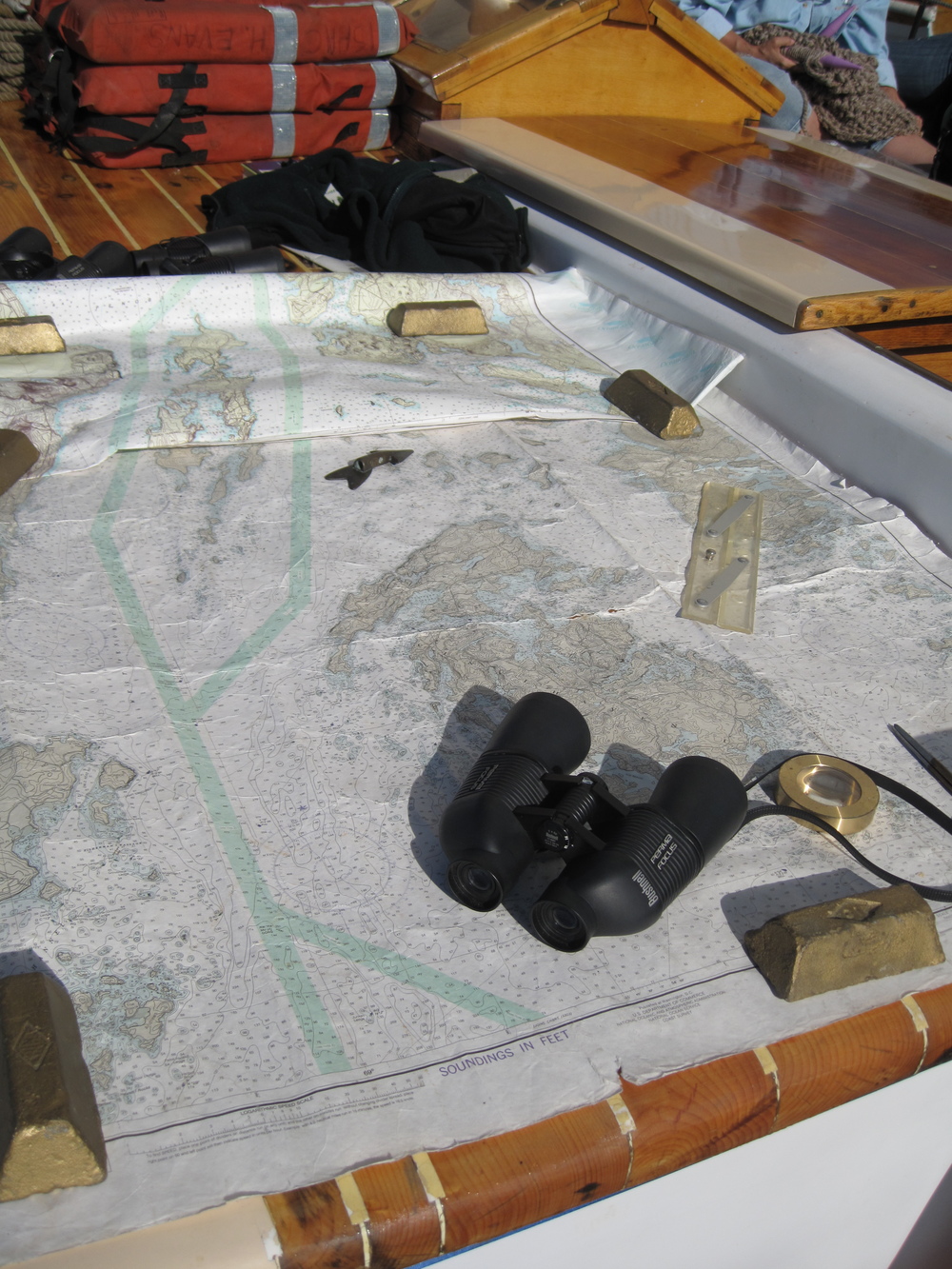  Captain Owen charting our path through Mid-Coast Maine on the  Isaac H Evans Schooner .&nbsp; 