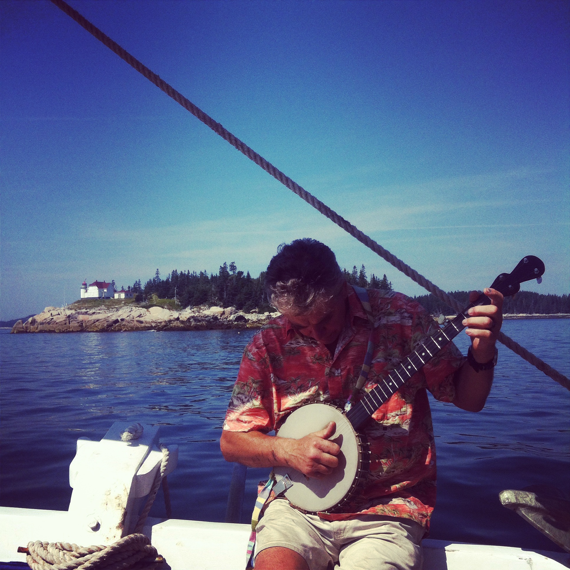  Cook and moto mentor, Greg Dorr, picking the banjo to the rhythm of the sea.&nbsp; 