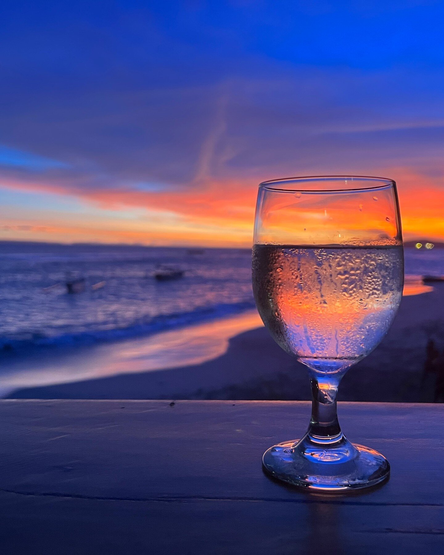 A tropical sunset,
held in a dewy glass, 
while we, tipsy on Mai Thai
and salty sea breeze,
watch the tide come in,
knowing, that soon,
Paradise is lost, 
on us. 

Bali moments and musings I never got around to posting, when I was &lsquo;just&rsquo; 