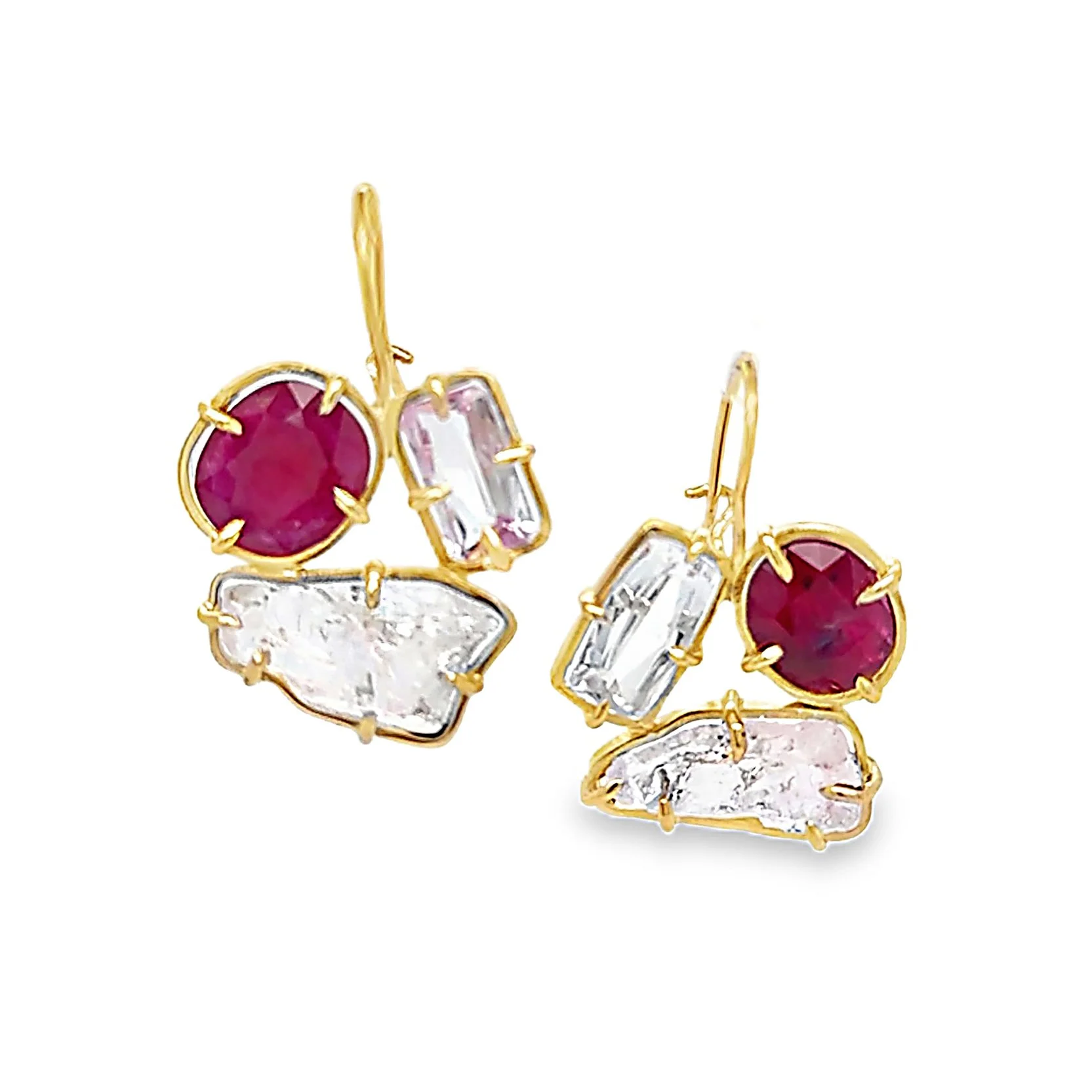 Pink and red gemstones set in yellow gold