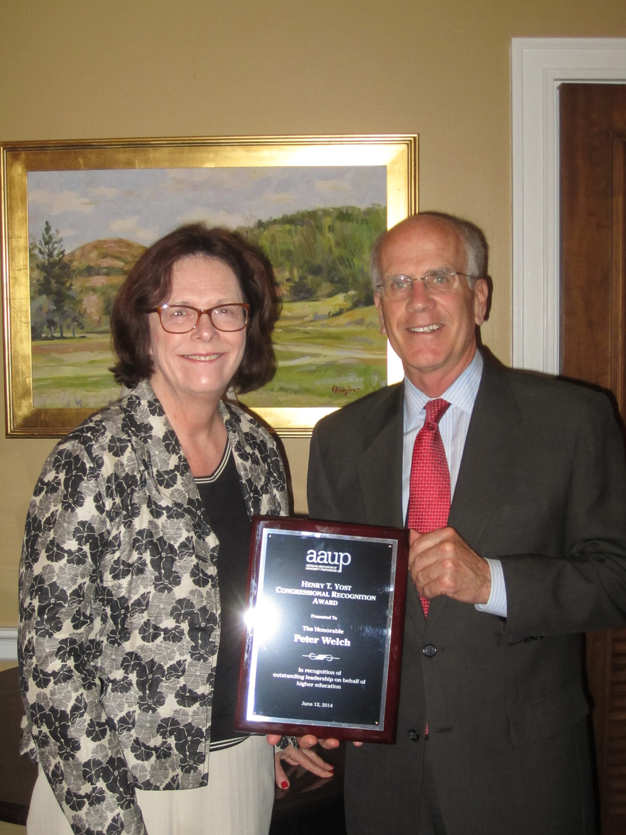 UA President Denise Youngblood presents the AAUP's Henry T. Yost Award to Congressman Peter Welch (D-VT)