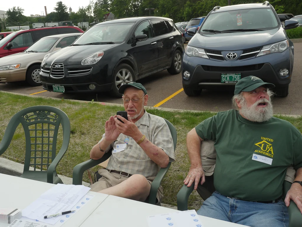 John talks to a member while Steve tries to figure out whether Harris v. Quinn has been decided