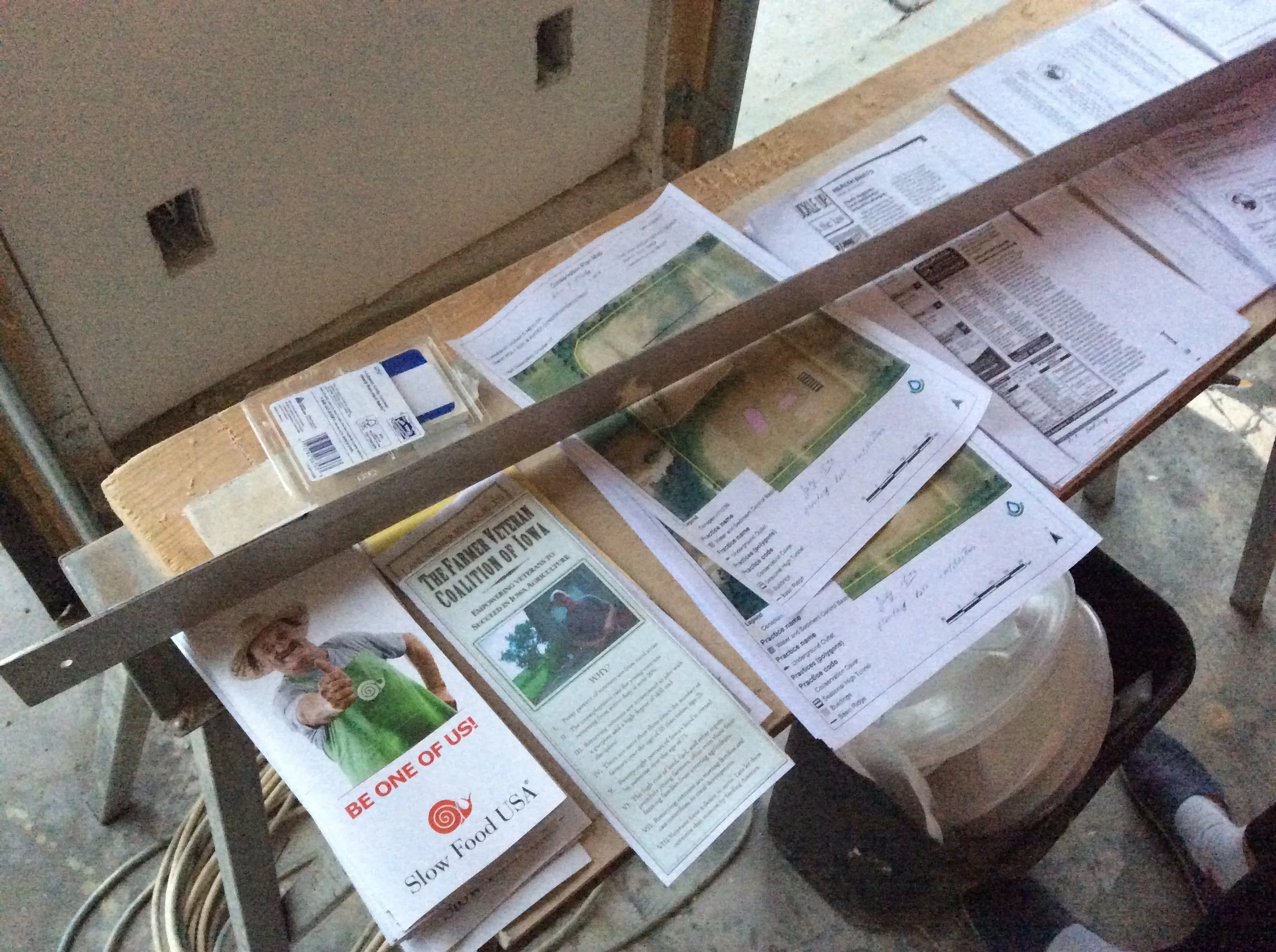  A collection of handouts in Ray's garage highlight the many ways he connects his work to a constellation of organizations and causes in the community. 