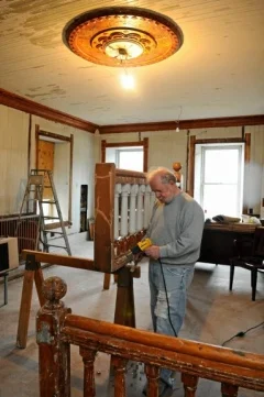 Jim Klock working to restore the Station House back to its original state.