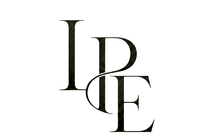 Stylized black and white text spelling spelling "LOVE" with artistic, overlapping lettering.