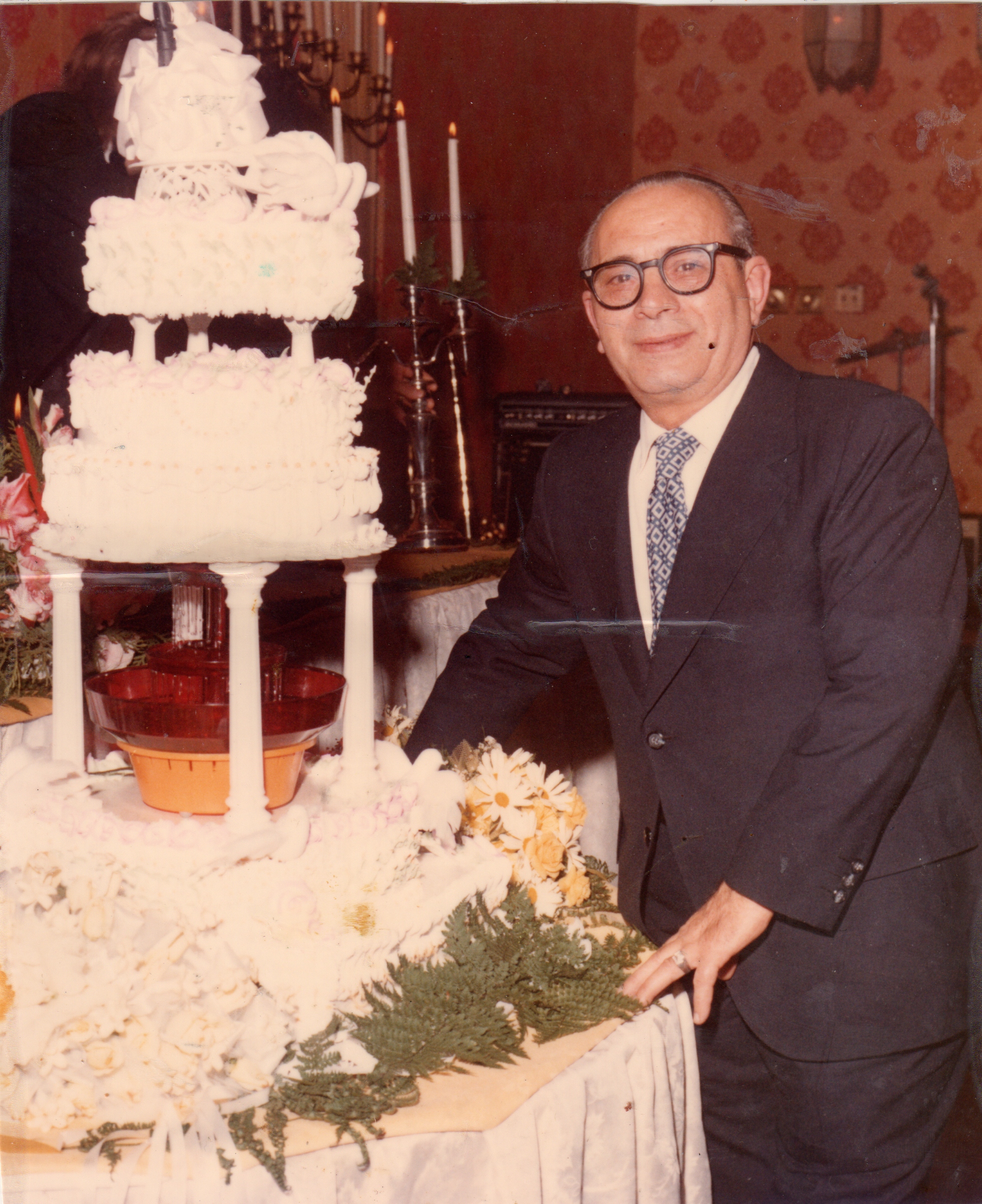 Sal & one of his Wedding Cakes.jpg