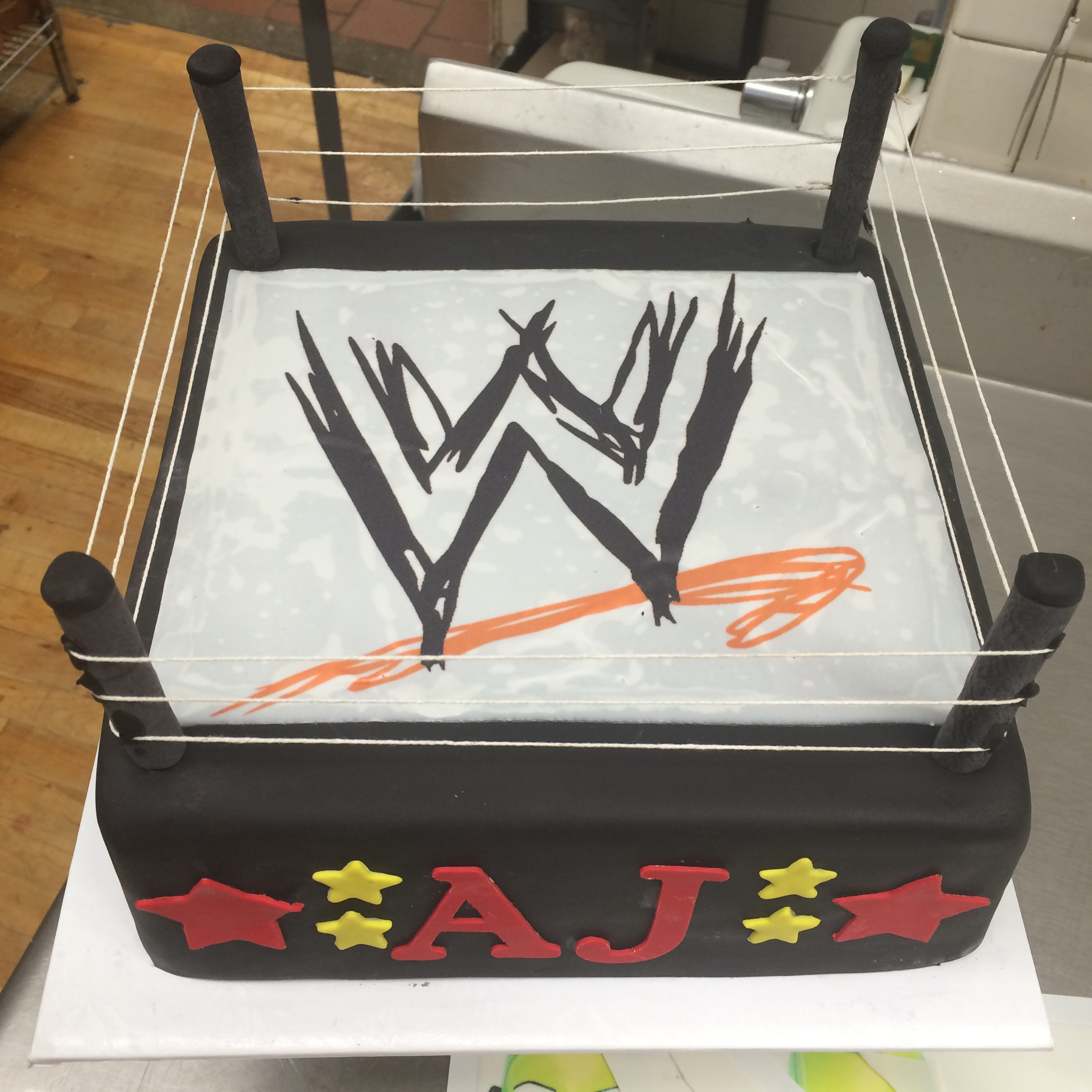 WWE wrestling ring in Rolled Fondant with Letters & Stars around. .jpg