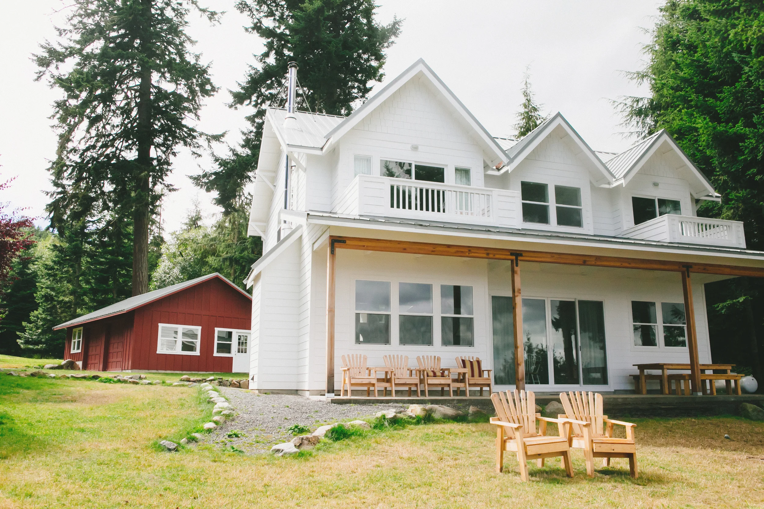 the orcas farmhouse sits on the same footprint as an old 1940s cabin. built in the style and feel of an old farmhouse, this modern home helps the property maintain its rural and rustic charm.
