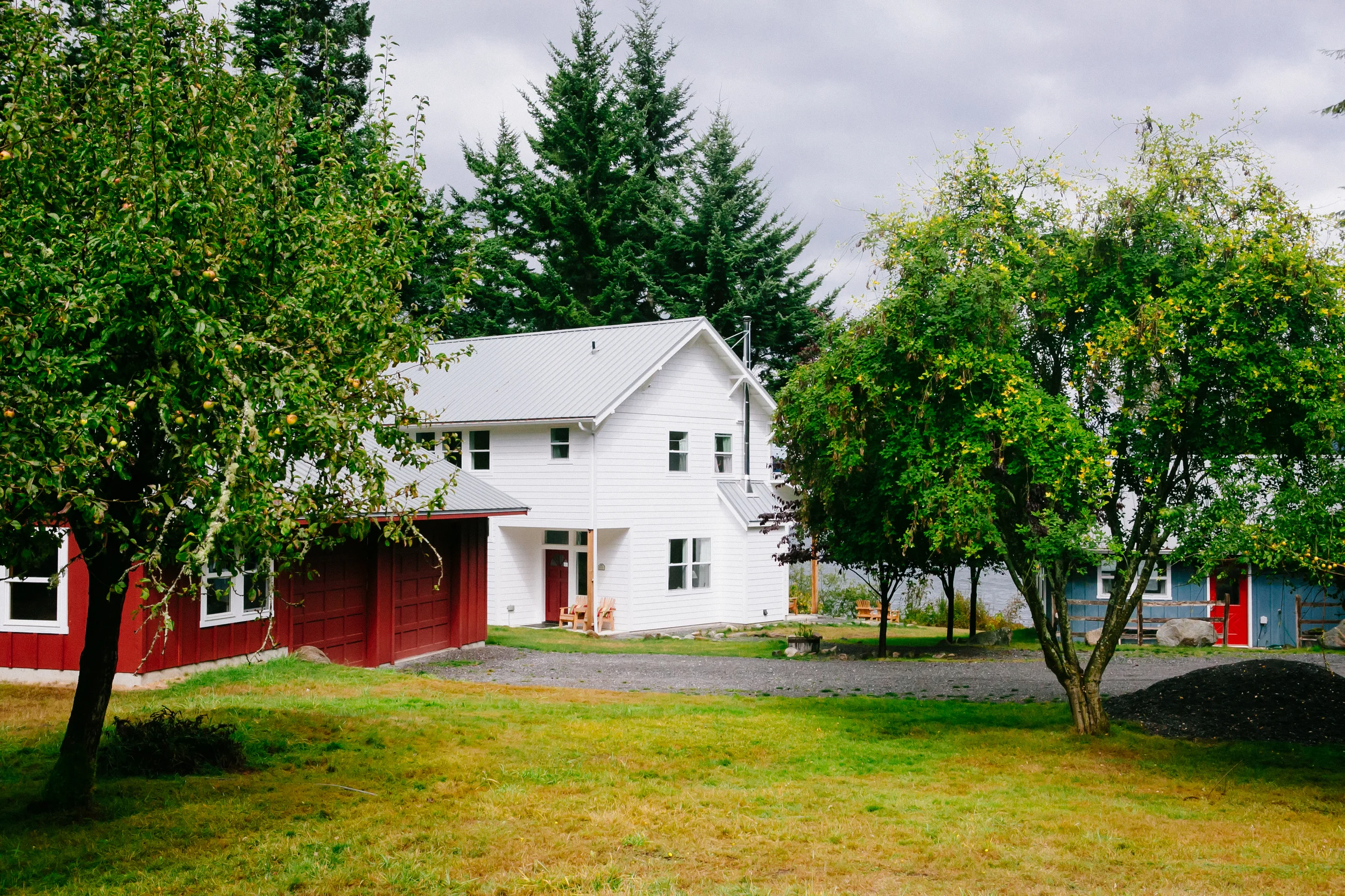 a view from the original garden and fruit orchard toward the main house and beyond, toward rosario strait and mt. baker.