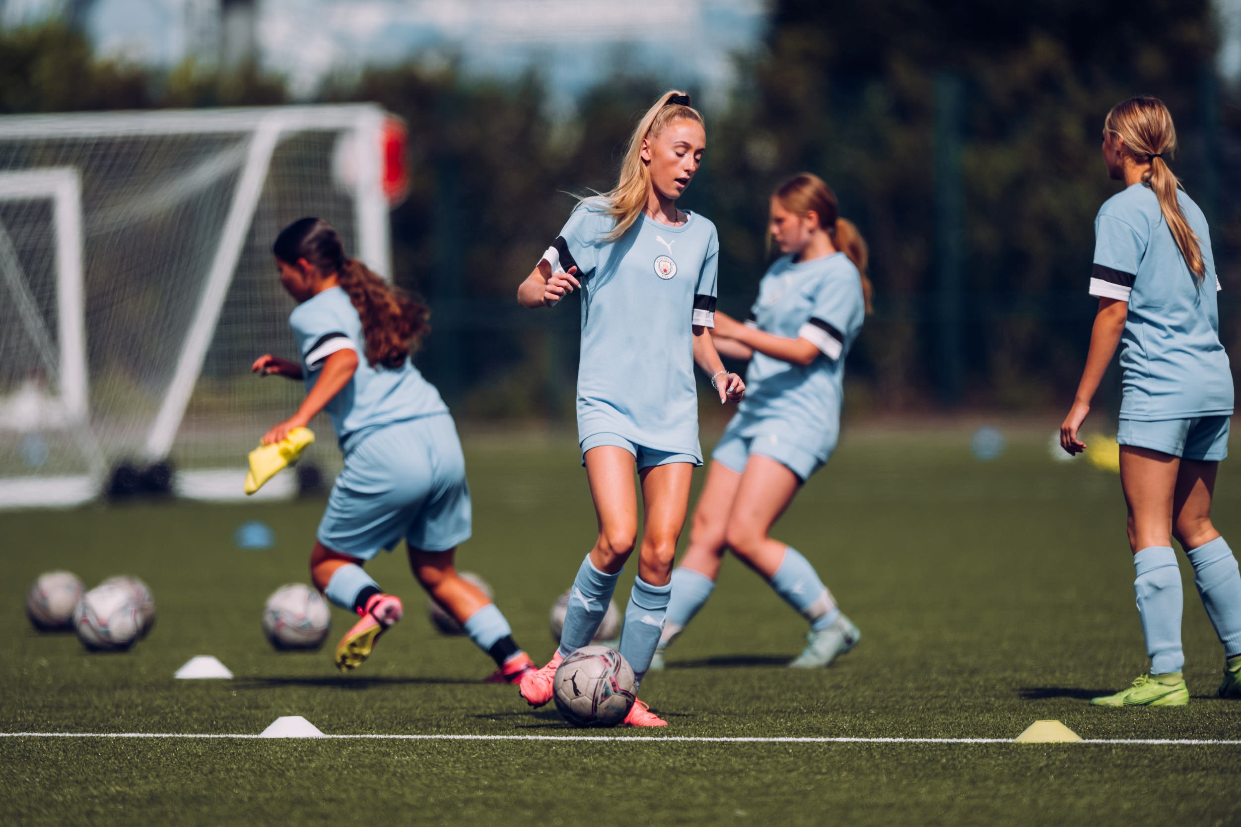 Girls summer soccer camp in Manxhester, England.jpg