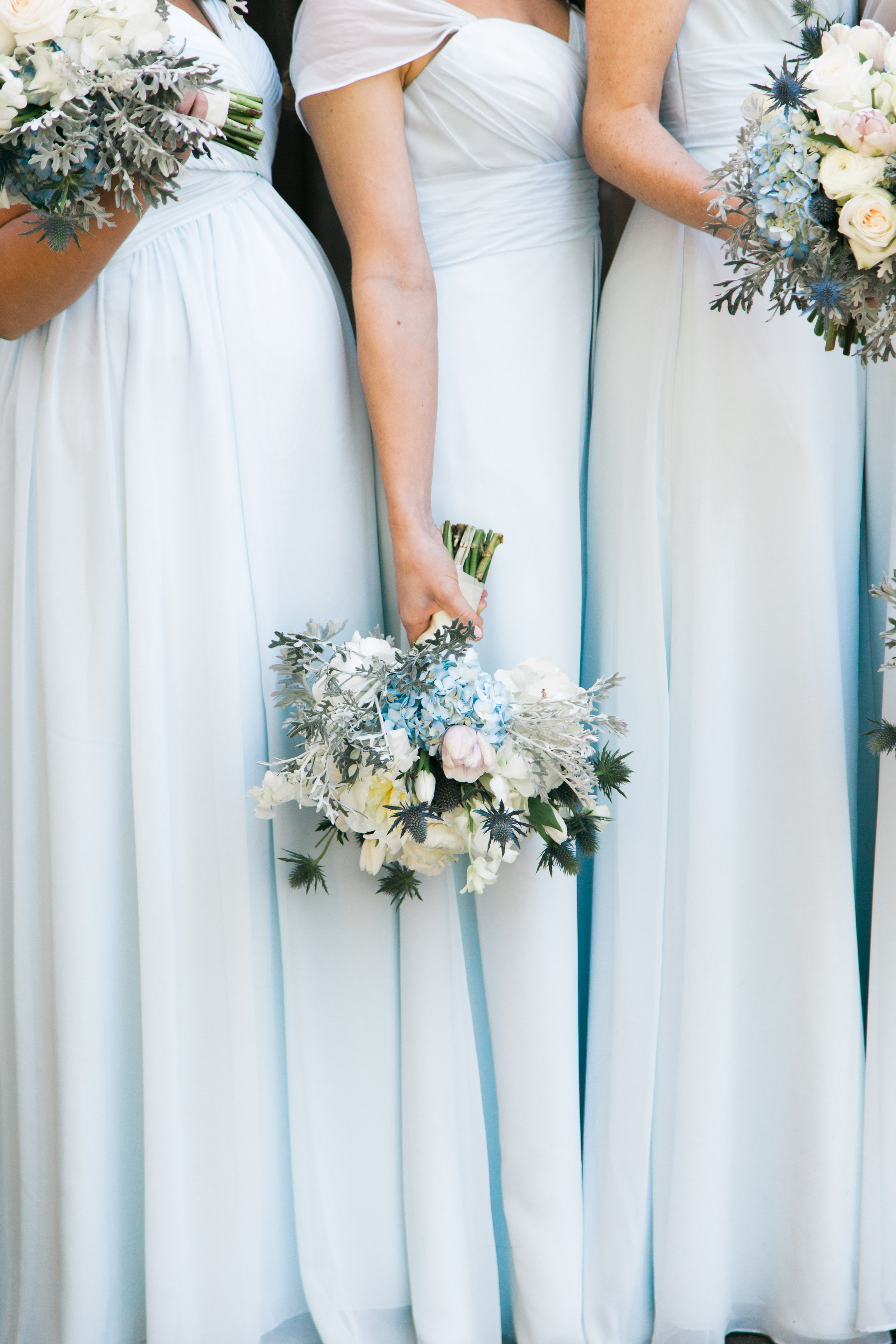 Gorgeous light blue bridesmaid dresses and wedding florals