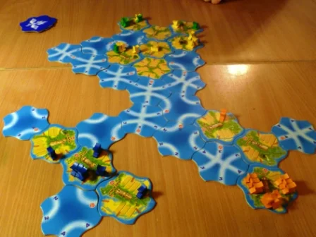 Tongiaki - Towards the end with both orange and blue sailing off into oblivion, leaving yellow to defend the home islands with a little help from green (I tried - I really tried but my boats kept sinking)