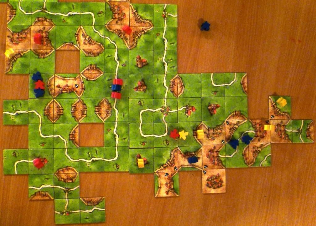 From left to right, Blue muscles in on reds field, red muscles in on blues road whilst blue has been diverted from joining the red/yellow field (bottom right).