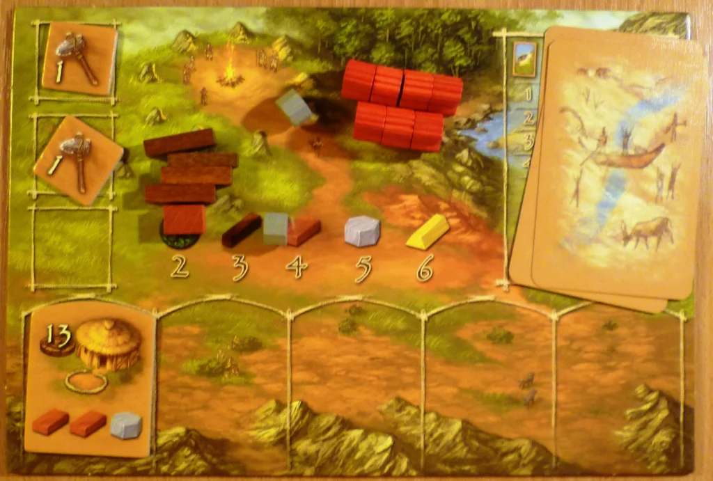 My player board early in the game with some collected wood - a brick and some tools.