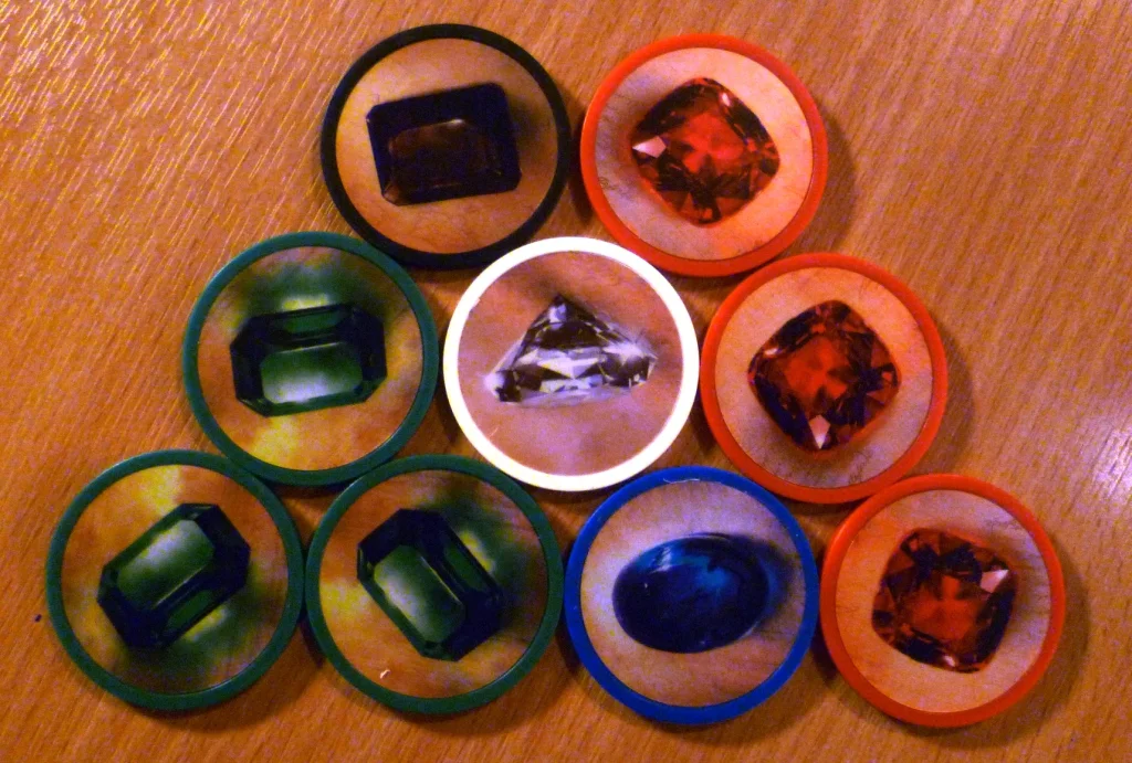 The gems collected in Splendor - the sturdy chips have a nice feel and I think are better than the small plastic chips you get in some other games.