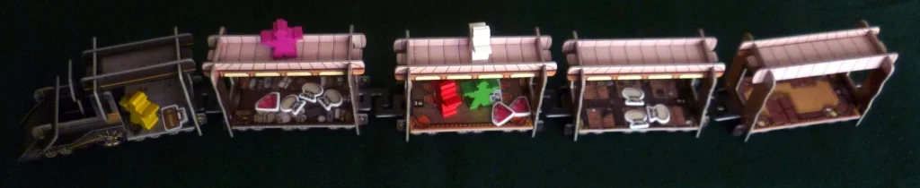 Four player game with cash bags and Gems inside the carriages