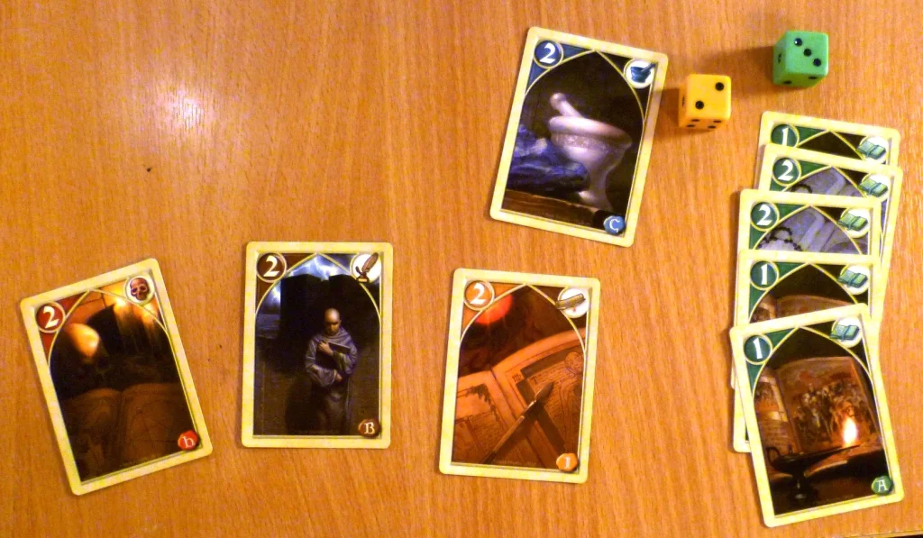 The winning hand in Biblios winning 2 of the dice and 5 points.