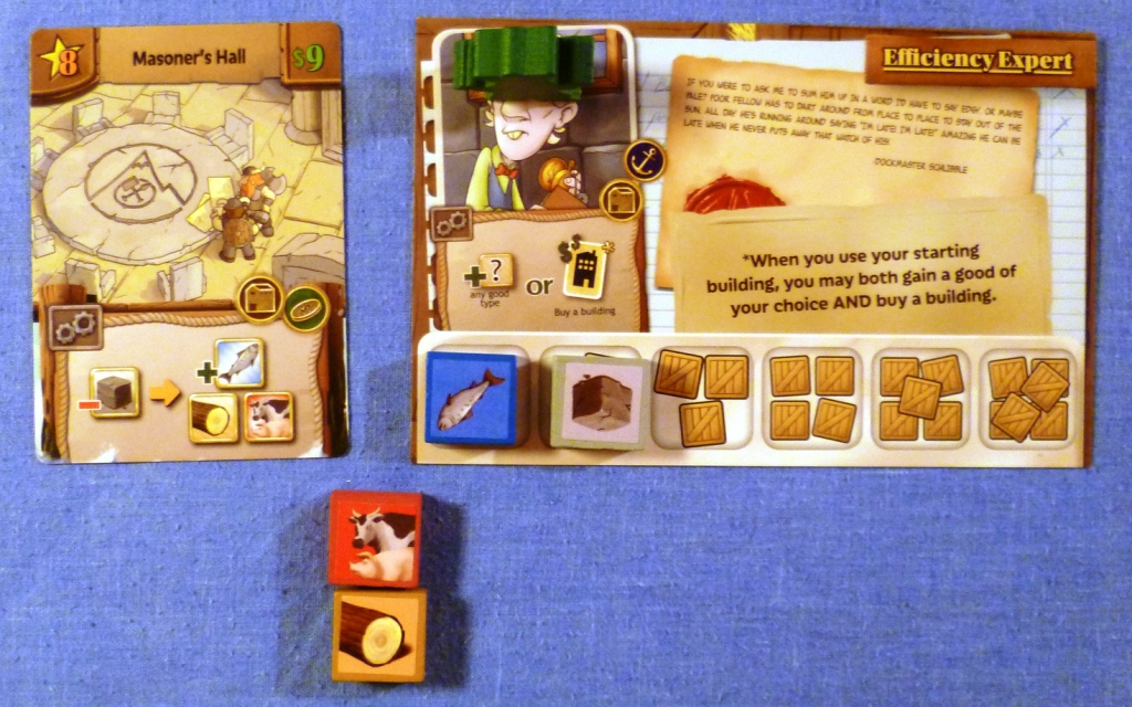 A players position early in the game after purchase of his first building. The large card is the players character with special ability