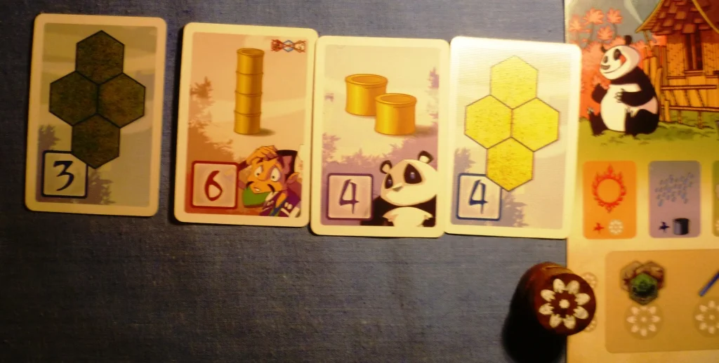 Mid game situation in the other game of Takenoko - You will notice more points cards than I had
