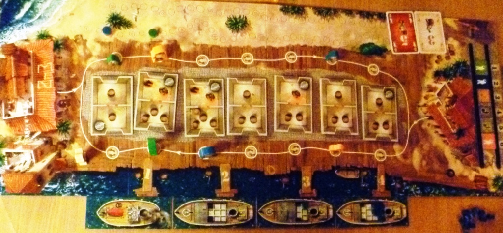 View of the board early in the game, a few deliveries have been made to ships (cubes on boats)