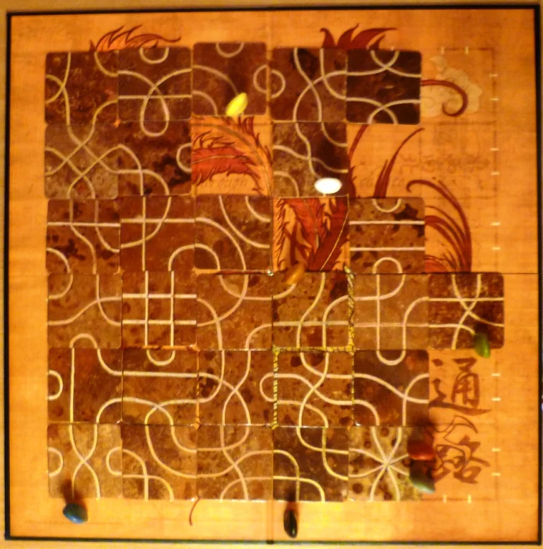 Two players already out, my red stone is in the bottom right corner where its fate is about to be decided by the green player.