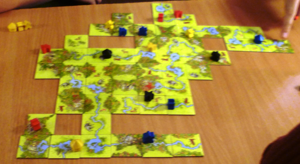 A rather blurry picture of the playing area showing rivers and forests