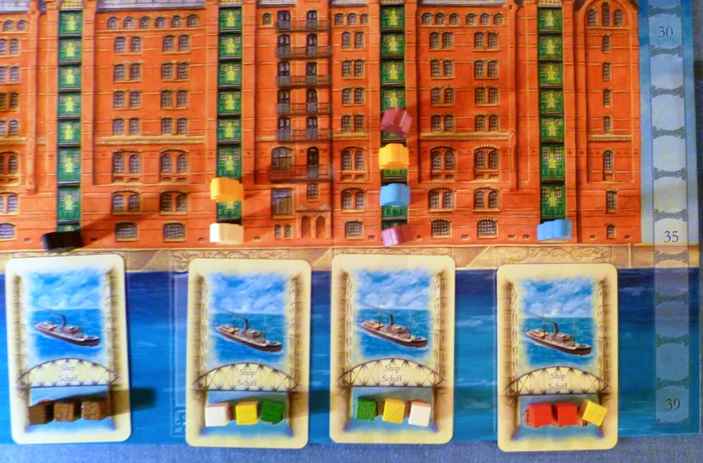 4 boats are up for grabs here (more cards are to the left) blue is looking at paying 2 for the 3rd boat if purple does not buy it for 3 first