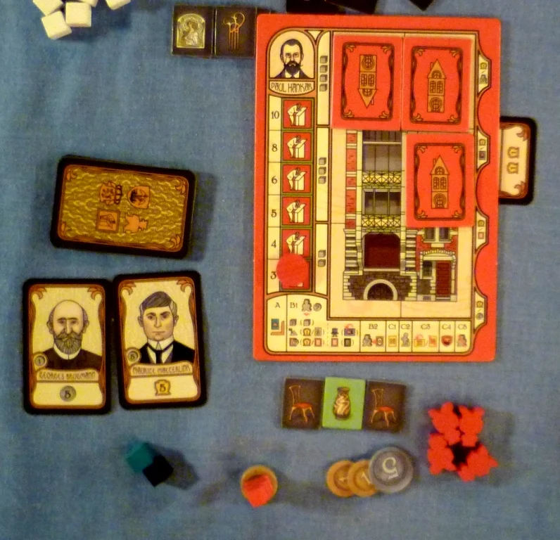 My play area showing workers available, cash, 2 people cards, 3 paintings, and my building card showing I have built 3 buildings, the next build will require 3 bricks and the built ones are worth 3 Victory points each.