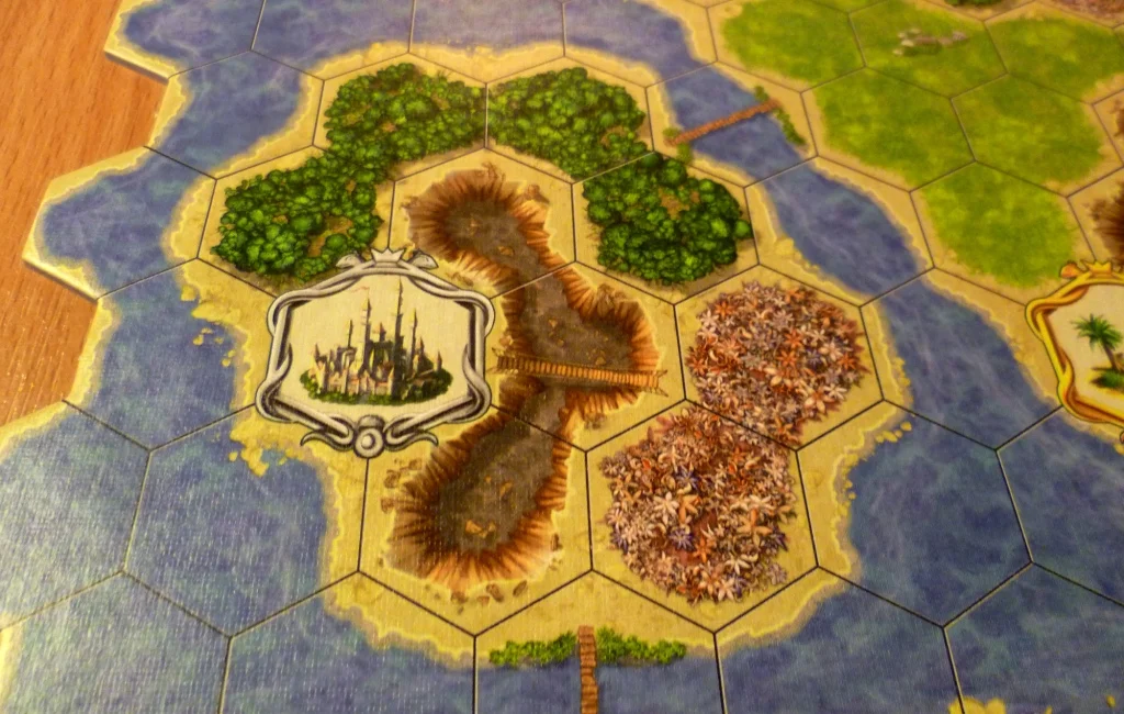 Part of the board showing a 3 point citadel with crags, flowers and a forest nearby