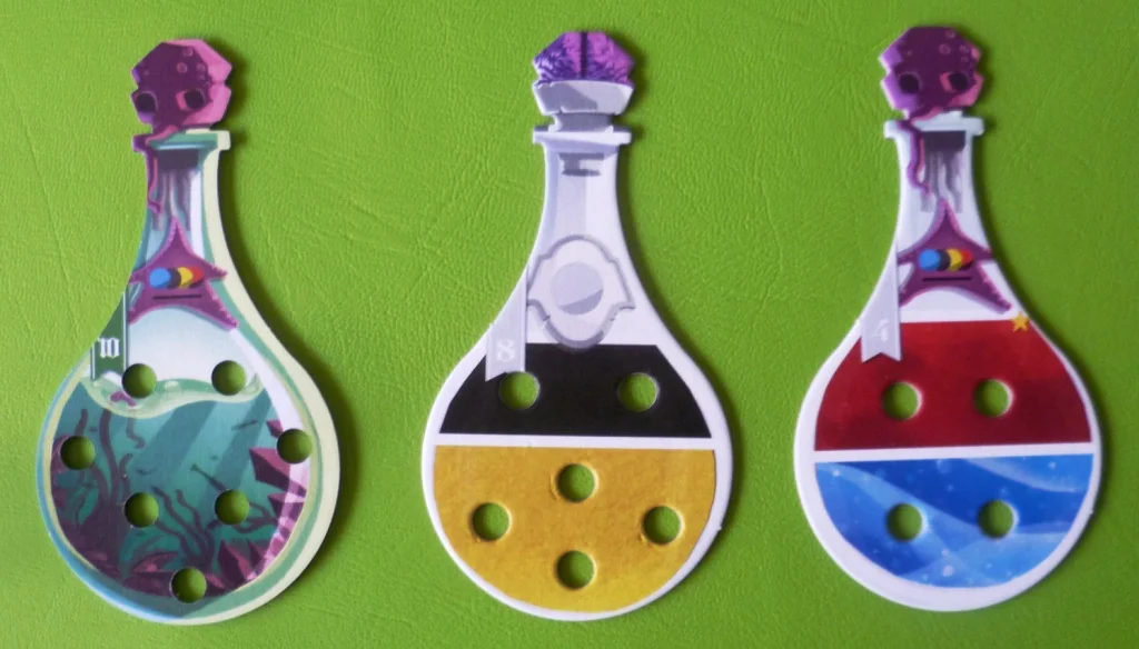 Flasks - the one on the left is completed giving 10 points, the right 2 flasks show what marbles are required.