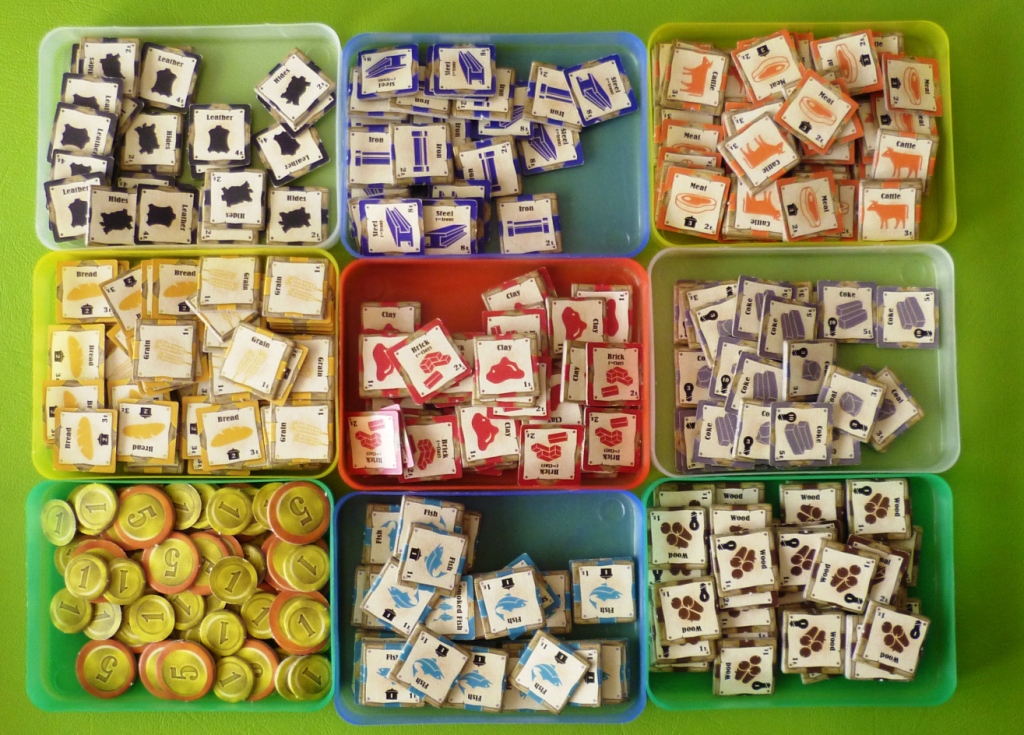 The resource tokens all of which (except coins) are 2 sided showing a base resource e.g. Clay and on the reverse an upgraded resource e.g. brick, wheat becomes bread, coal becomes coke etc.