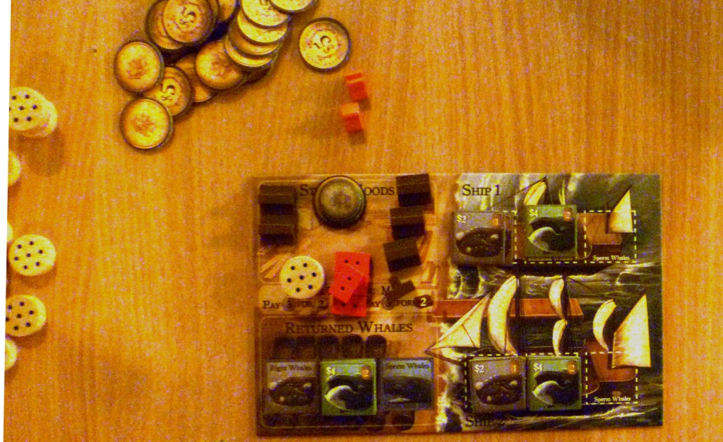My player board with my few resources, the wales on my 2 ships (stacks on the right of the board) Wales in storage and thus scoring bottom left of the board.