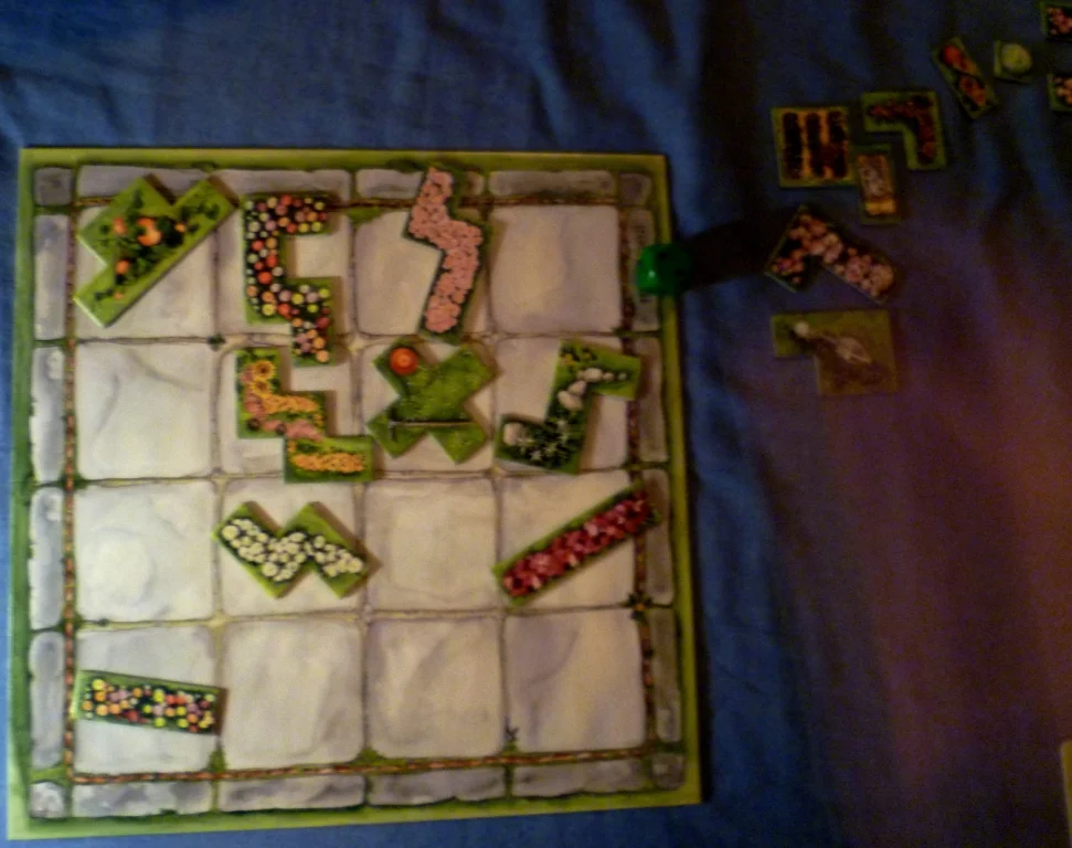 The central board, emptying quickly, when the die reaches the bottom row it will refill empty spaces from the path of tiles at the side of the board