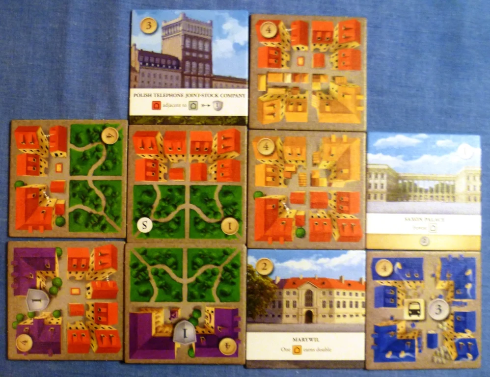My layout during the game, my park has 4 separate residential areas scoring 5 points, my commercial area gets me 3 cash but my special tile at the bottom doubles this to 6 cash.